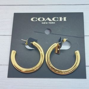 Coach hoops with tag charm. Gold color.